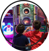 Kids enjoying an arcade game.