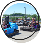 People racing go karts.